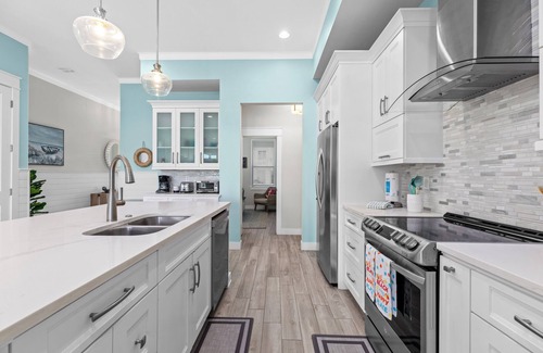 The Shores Cottage | Sol Y luna home at The Shores, sandy steps to the bay, short walk to the beach