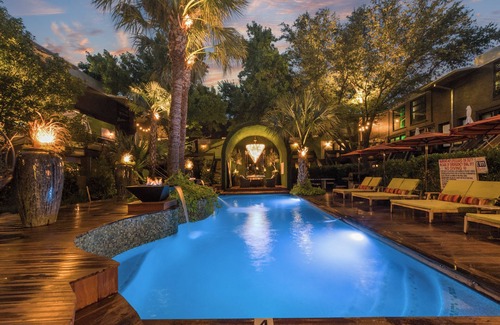Old East Dallas Condo | Sophisticated 2-Bed, 1.5-Bath furnished condo in central Dallas with a private patio, serene garden views, and exclusive access to an award-winning courtyard equipped with premium wellness products and relaxing lounge areas.