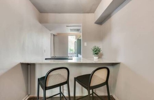 Old East Dallas Condo | Sophisticated urban loft with king suite, resort pool, and secured parking.