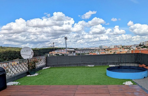 Santo Condestavel Apartment | Spacious 2-Bedroom Duplex with Private Roof Deck and Gym in Campo de Ourique