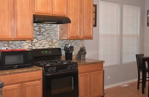 Streamwood House | Spacious 3 bedroom home with King bed/Queen bed. Fun game room and Theater room.