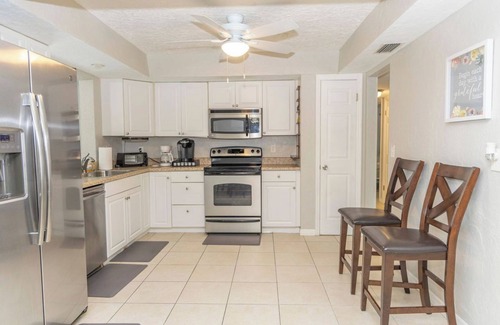 Oakland Hills House | Spacious 4/2 with heated pool and lake view FREE GOLF! Close to gulf beaches!