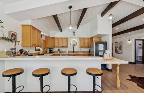 Lakeside House | Spacious 7-Bed Home w/Hot Tub, Fireplace, Gym, Wine Bar, and 2 Living Spaces!