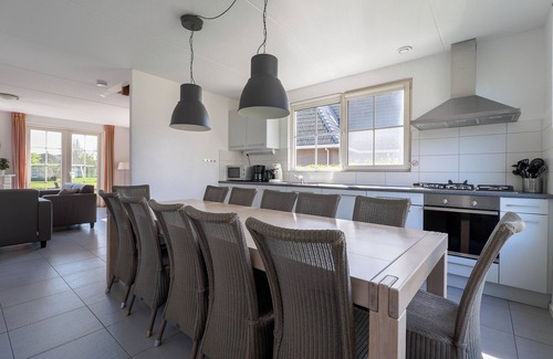 Makkum Cabin | Spacious Beachvilla for 12 people with six bedrooms, a double walk-in shower, and a large yard at Beach Resort Makkum.