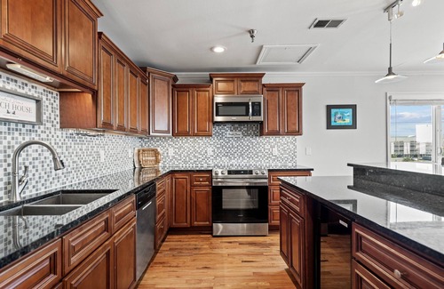Carolina Beach Condo | Spacious condo close to everything! Elevator, gameroom garage, kid/pet friendly!