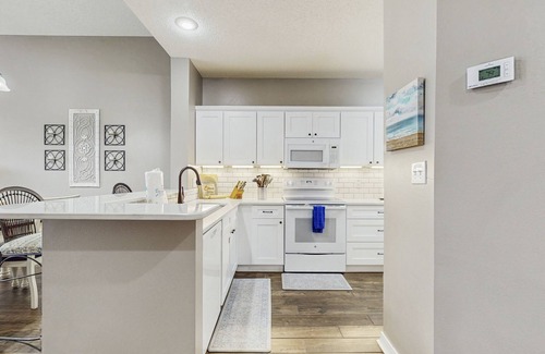 Gulf Shores Condo | Spacious condo with water views, private balcony, & on-site pool