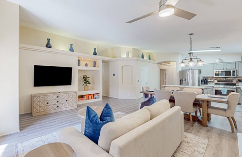 Canyon Ridge West House | Spacious desert home with hot tub, covered patio, grill, & modern finishes