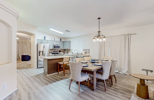 Canyon Ridge West House | Spacious desert home with hot tub, covered patio, grill, & modern finishes