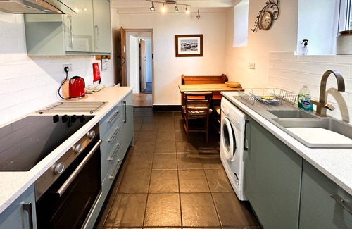 Langthwaite Cottage | Spacious detached holiday home, sleeps 7 with 2 furry friends, free WiFi, two pubs nearby.