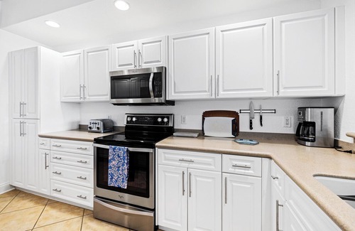 Inlet Villas Condo | Spacious Gated Minorca Retreat, Pet Friendly with Pond Views and Resort Amenities - MM403