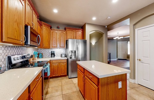 Glendale House | Spacious home surrounded by palms with pool, grill, children's items, & W/D
