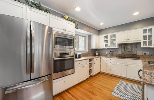 Maple City House | Spacious home with studio, lake access, sunroom, fireplace, W/D, & central AC
