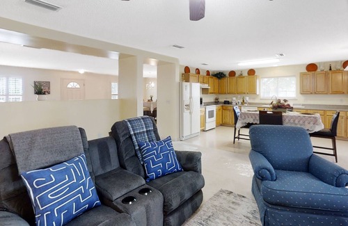 Westside House | Spacious home with sunroom, patio, fireplace, & water views