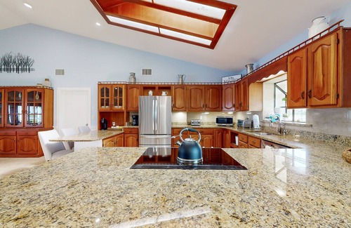 Lake Placid House | Spacious home with enclosed pool, private lake access, and game room.
