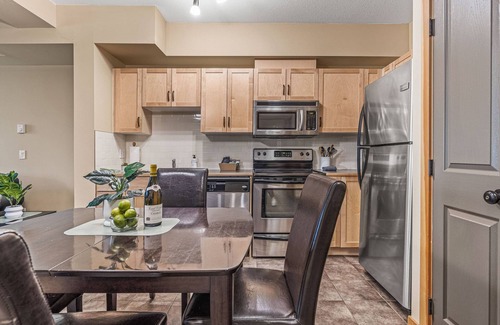 Canmore Apartment | Spacious King Bed with Pool & Hot Tubs