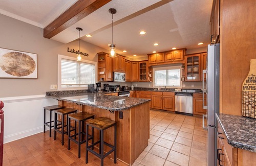 Waterfront Greens House | Spacious Lake Retreat w/Hot Tub & Fireplace