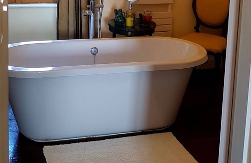 Cast Apartment | Spacious luxury Studio Room with king-size bed, and freestanding bath