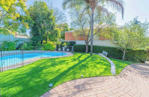 Greater Johannesburg Metropolitan Area House | Spacious Manor with Cozy Fireplace, Garden & Pool