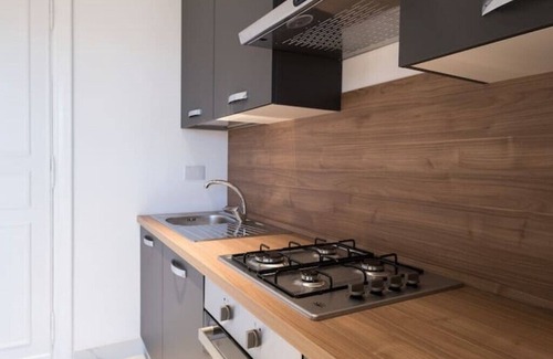 Esquilino Apartment | Spacious penthouse with gym in historic building, near the Colosseum