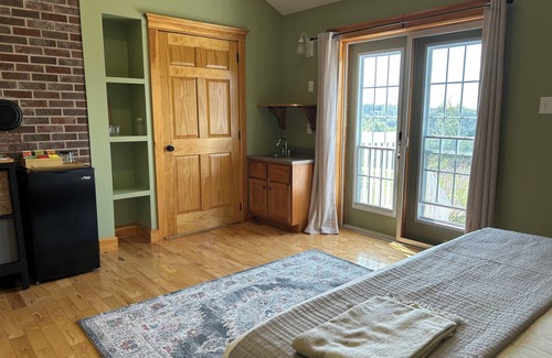 Hall's Harbour Bed & Breakfast | Spacious room with sunset patio, 5 minutes from beach, restaurant and harbour