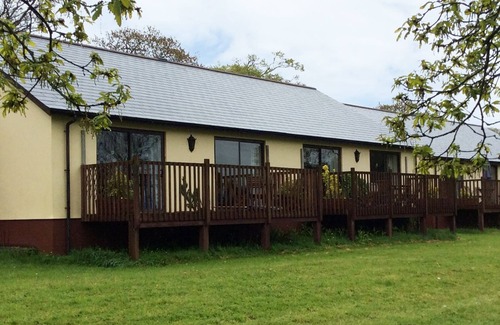 Holsworthy House | Spacious two-bedroomed fully-accessible lodge with lake view in rural idyll
