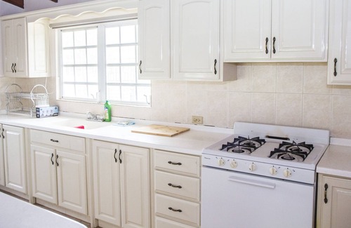 Dickenson Bay Villa | Spacious villa in mature gardens, near beaches, shops and reputable schools.