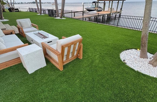 St. Petersburg House | Spacious Waterfront Tropical Oasis: Hot Tub, Dock & Turf