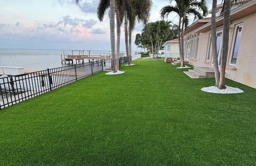 St. Petersburg House | Spacious Waterfront Tropical Oasis: Hot Tub, Dock & Turf