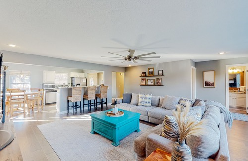 Garfield House | Spacious waterfront home with a washer/dryer, central AC & deck