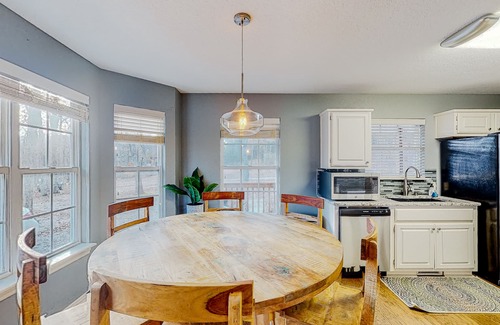 Garfield House | Spacious waterfront home with a washer/dryer, central AC & deck