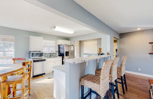 Garfield House | Spacious waterfront home with a washer/dryer, central AC & deck