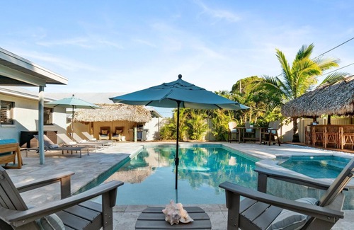 Naples Park House | Spared by Ian! Pool. Spa. Tiki! |Walk to Beach|Nina's Tiki Beach House