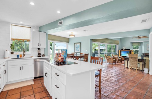 Mid Island House | spectacular architectural home steps to the beach w/private heated pool on canal