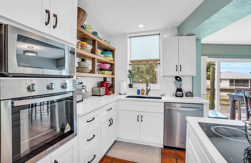 Mid Island House | spectacular architectural home steps to the beach w/private heated pool on canal