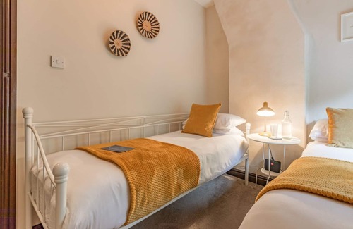 Tunstall Cottage | Spend an evening relaxing by the wood burner after a day exploring the local walks and attractions.