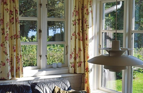 Kirke Hyllinge House | Stay close to the fjord in this cozy cottage that is perfect for relaxation and socializing.