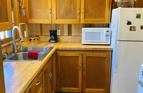 Estes Park Cabin | Stay in this charming vintage cabin with a wood burning fireplace,