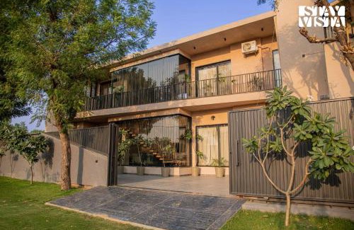 Jaipur Villa | StayVista at Urban Escape - 2 Pools, Lawn & WiFi