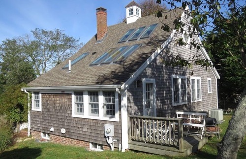 Chatham House | Step back in time in this beautifully maintained antique horse barn cottage!