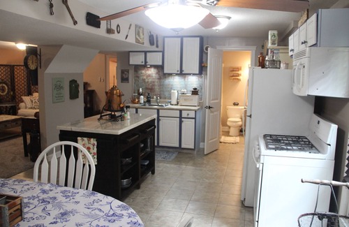 Eudora House | Step Back In Time to a charming 2-bedroom lower level house in adorable Eudora