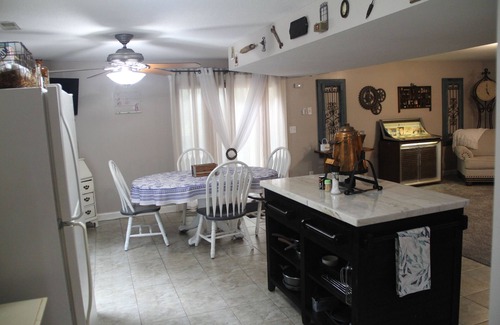 Eudora House | Step Back In Time to a charming 2-bedroom lower level house in adorable Eudora