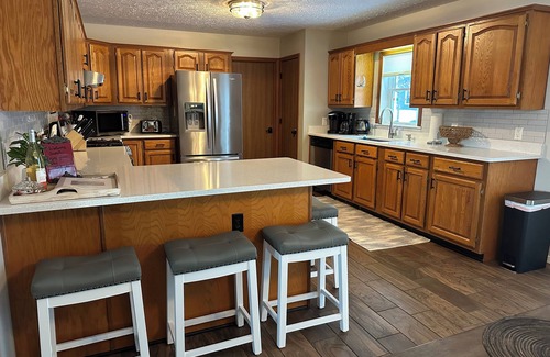Boyne City House | Steps from Lake Charlevoix with great views. Pool & beach access for a fee.