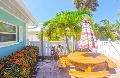 Holmes Beach Villa | Steps to the Beach with Shared Heated Salt Pool and Private Backyard & Grill