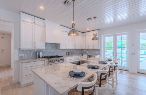 Connors House | Steps to Vanderbilt Beach, Sleeps 13, Resort-Style Backyard