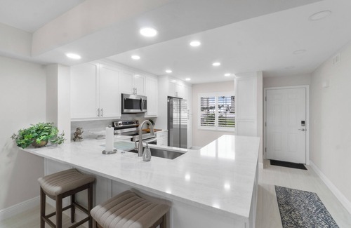 Vanderbilt Beach Condo | Steps to Vanderbilt Beach | Bright 2BR + Den with Bay Views