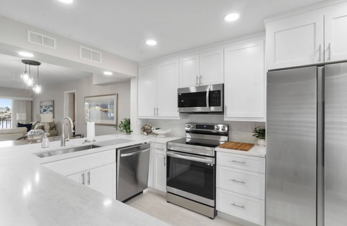 Vanderbilt Beach Condo | Steps to Vanderbilt Beach | Bright 2BR + Den with Bay Views
