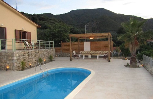 Keryneia House | Stone house with pool and view to the sea