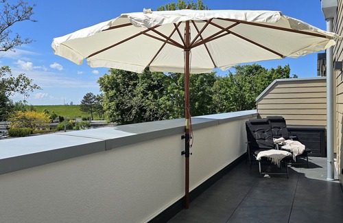 Tossens Apartment | StrandGut 49 - Penthouse with a view. Sauna. Roof terrace. Exclusive.