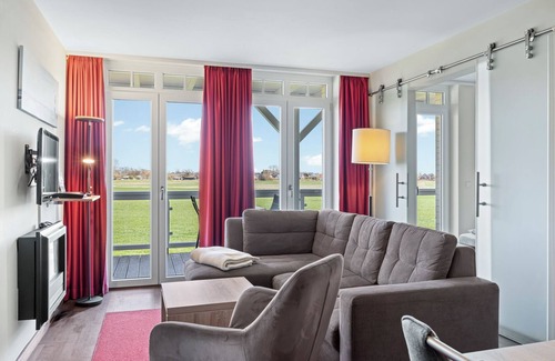 Wremen Apartment | Strandnahe Ferienwohnung mit Sauna, Tollem Balkon mit Strandkorb und Landblick