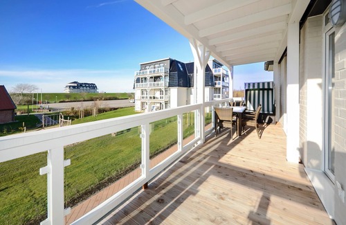 Wremen Apartment | Strandnahe Ferienwohnung mit Sauna und Tollem, Überdachtem Balkon mit Deichblick